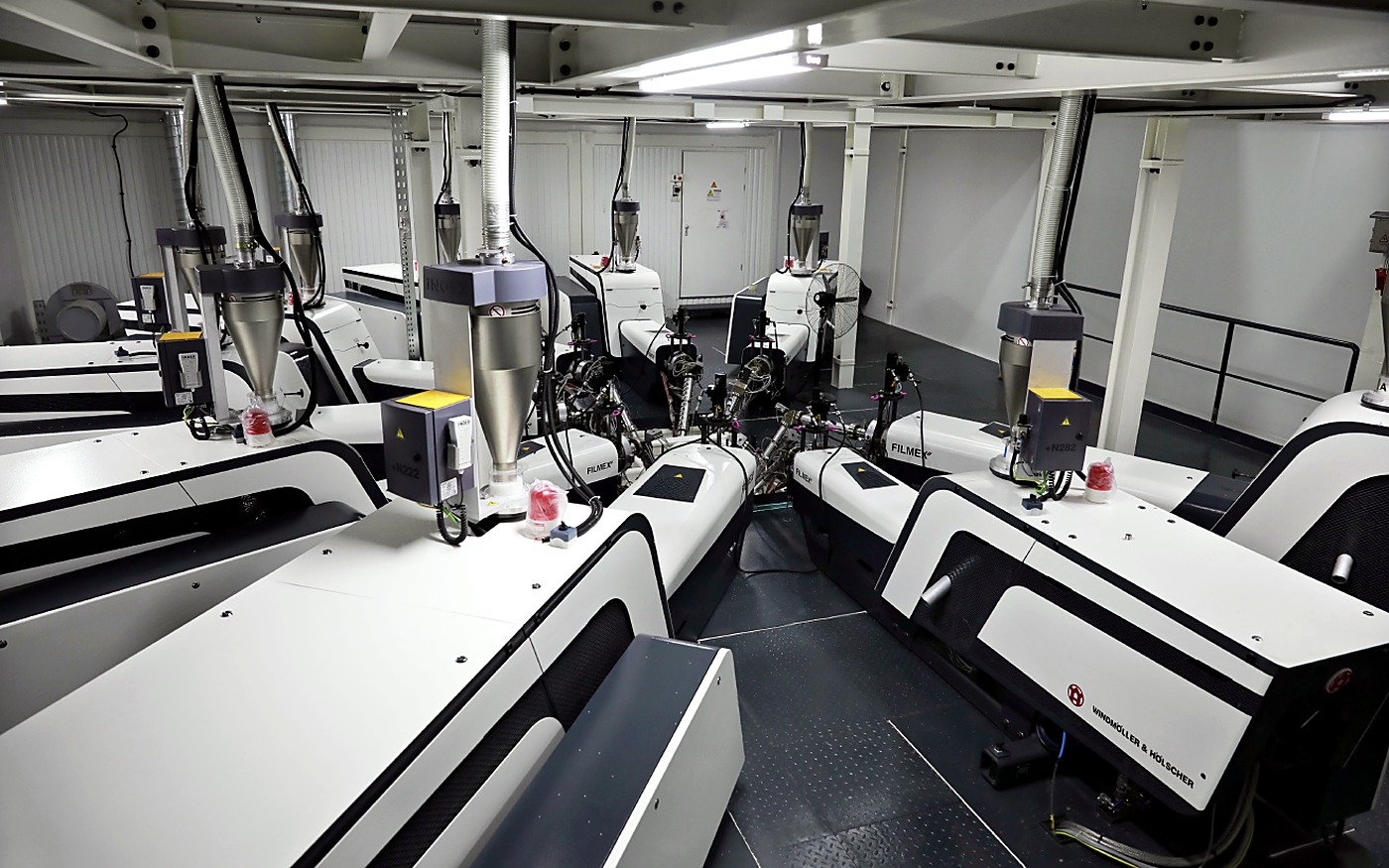 Extrusion and converting machines on the factory production floor